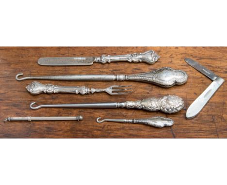 A mother-of-pearl handled fruit knife Sheffield 1929, filled silver handled small boot button hook 1880, a Chester button hoo