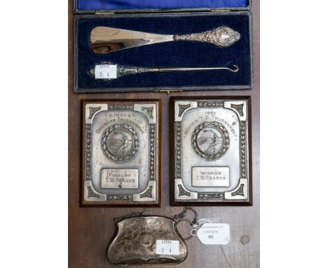 A cased silver handled shoe horn and button hook, hallmarked Chester 1910, silver purse and two 1930s sporting plaques to TW 