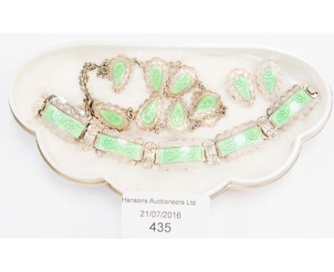 An English silver necklace, earrings and bracelet parure with green enamel detailing