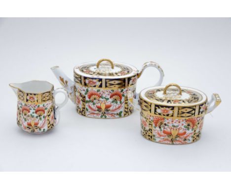 A Royal Crown Derby Sampson and Hancock Imari pattern part tea set, comprising teapot, two handed sucrier and a small cream j