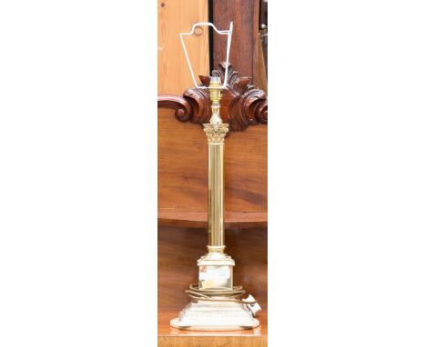 A modern brass column table lamp