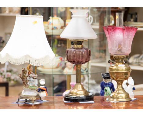 Two Victorian cranberry glass and brass oil lamps, table lamp in the form of a girl (3)