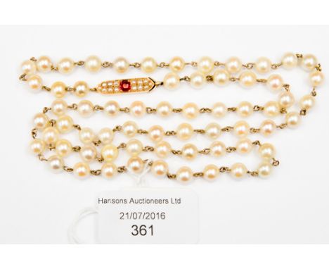 A cultured pearl single row necklace, light cream beads, approx 6-7 mm, boat shaped snap clasp, ruby and seed pearl set, appr