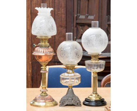 A Youngs central draft, 20" court, brass oil lamp, copper reservoir, etched frosted glass shade; a Made in England Duplex oil