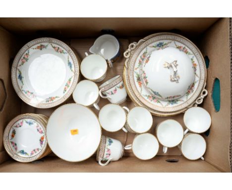 A 19th Century hand painted teaset, comprising ten cups, eleven saucers nine tea plates, covered dish, two cake plates, large