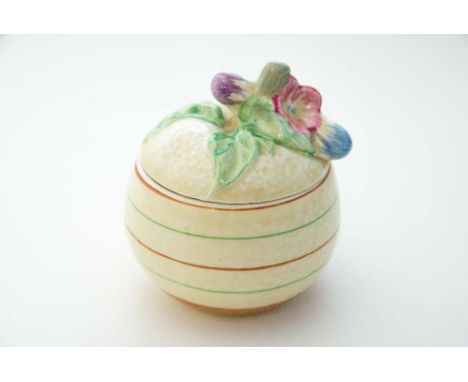 Clarice Cliff for Newport Pottery, a small marmalade pot of orange form, concentric ring decoration
