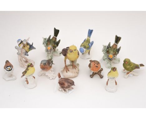 A collection of twelve Goebel bird figures, mostly bearing labels to undersides, including 'Blue Tit', 'Wren', 'Greenfinch', 