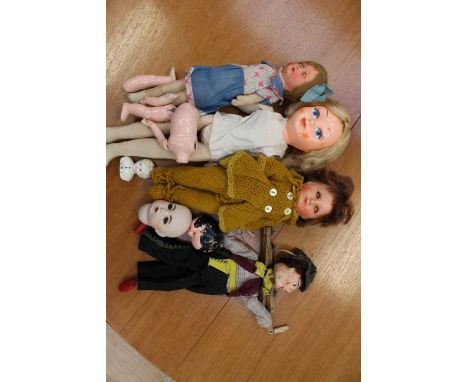 A celluloid headed and stuffed fabric body 1950s doll, possibly imported, a composite doll, a 1920s composite doll (needs new