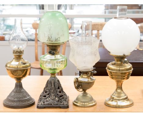 A British made Duplex brass oil lamp, a Youngs screw no.1, green tinted glass reservoir, with an etched green glass tinted sh