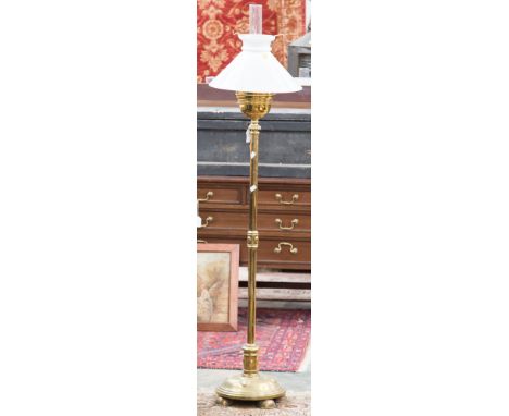 A brass stick/umbrella stand, a brass standard lamp and a brass surround glass painted fire screen (3)