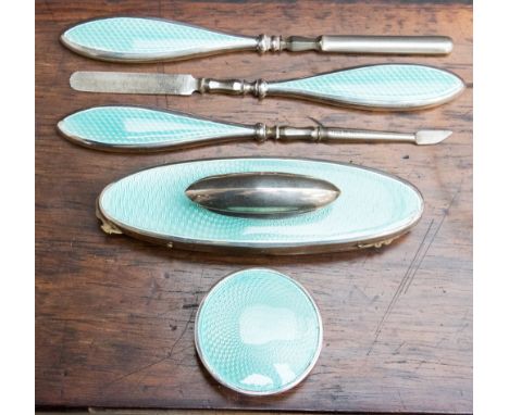 A Chester 1928, hallmarked silver and enamel dressing table manicure set, maker Charles Perry & Co, including a silver pot an
