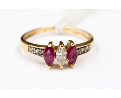 A marquis cut ruby and diamond three stone ring, small size I