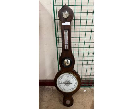 A Victorian walnut aneroid barometer, signed J.J Lockwood, Preston