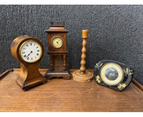 Three mantel clocks and a beech candlestick 
