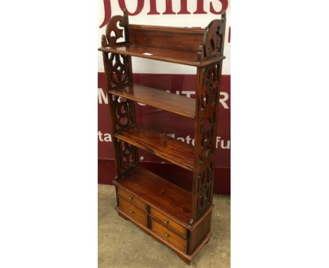 A small Chippendale style hardwood open bookcase 