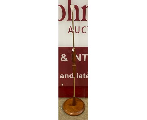 A teak standard lamp 