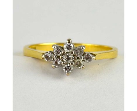 An 18ct gold diamond cluster ring, the trapezium shaped top with tiny diamond cluster, size N, approx. 2.4g.