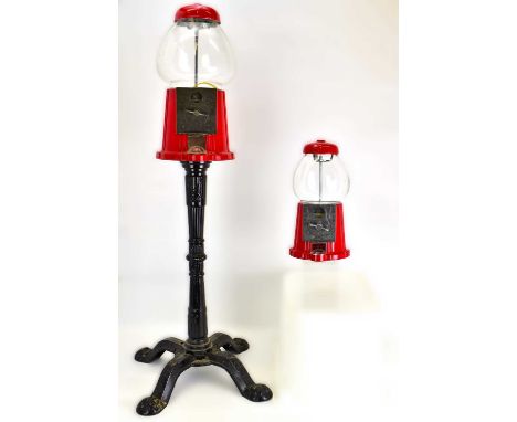 Two vintage gumball dispensers, the largest by Carousel on replica cast iron style stand to four splayed supports, height 95c