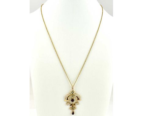 An Edwardian 9ct gold pendant set with seed pearls and bezel set amethyst on a 9ct dainty chain, length 48cm, with box clasp,