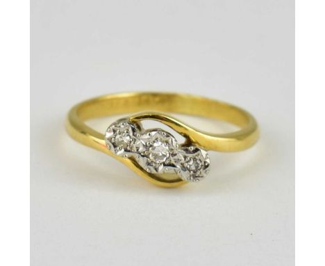A 9ct gold three-stone illusion set diamond ring, size K, approx. 2.5g