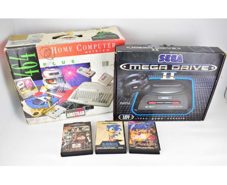 SEGA; a boxed Megadrive II console with three games, and a boxed Amstrad 464.Condition Report: Not tested cannot guaratee wor
