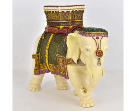 ROYAL WORCESTER; a James Hadley designed porcelain vase, modelled as an elephant with howdah, green, red and gilt-heightened 