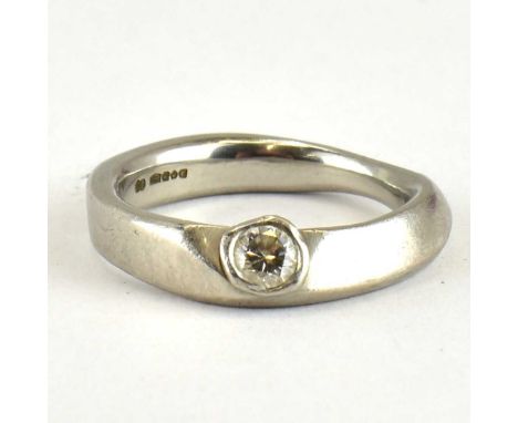 A platinum (grade 950) solitaire ring set with single bezel set diamond, approx. 0.2ct, size P, approx. 10g.