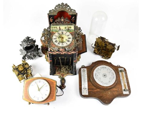 A large quantity of various 19th century and later clock parts, including cases, movements, pendulums, etc.