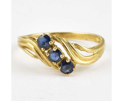 A 9ct gold ring with claw set sapphire to scroll shoulders, size O, approx. 1.9g.