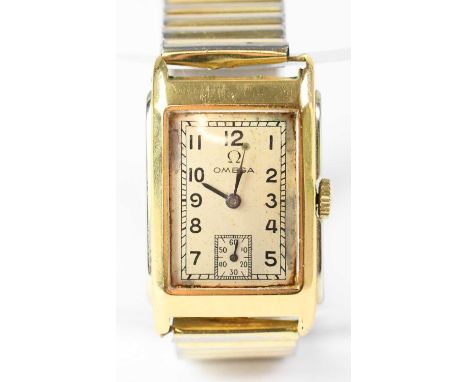 OMEGA; an 18ct yellow gold cased tank wristwatch, the silvered dial set with Arabic numerals and subsidiary seconds hand, set