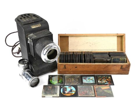 A Magic Lantern stamped 'Johnson Oloscope' together with two lenses and a quantity of magic lantern slides, to include subjec