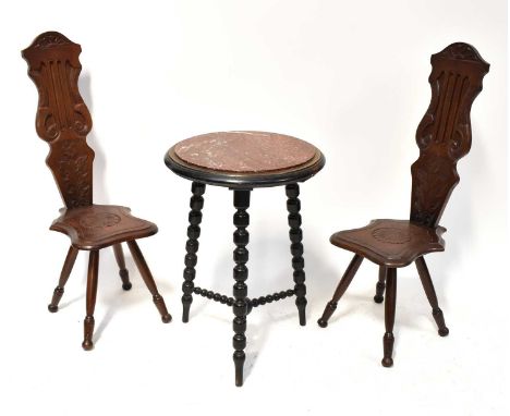 A pair of reproduction spinning chairs with carved floral decoration, height 91cm, together with a marble topped bobbin turne