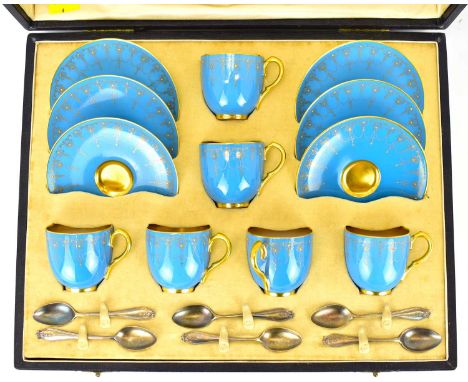 ROYAL WORCESTER; a set of six demitasse coffee cups and saucers in light blue, embellished with Classical gilt swags, height 