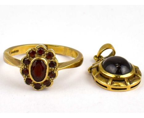 A 9ct gold ruby cluster dress ring, size P, approx. 3.4g, together with a 9ct gold necklace pendant with central red cabochon