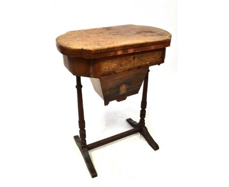 A Victorian burr walnut crossbanded and marquetry inlaid games and work table, the moulded top with hinged leaf enclosing a g