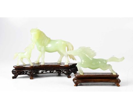 A Chinese carved jade figure group of  horse and foal, length 16.5cm, and a similar smaller figure of a horse, length 11cm (2