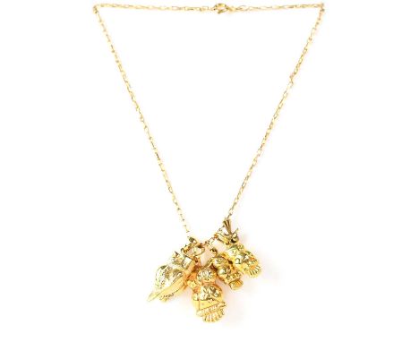 A group of 9ct yellow gold owl-related jewellery, comprising five pendants, a further pendant set with tiny white stones, on 