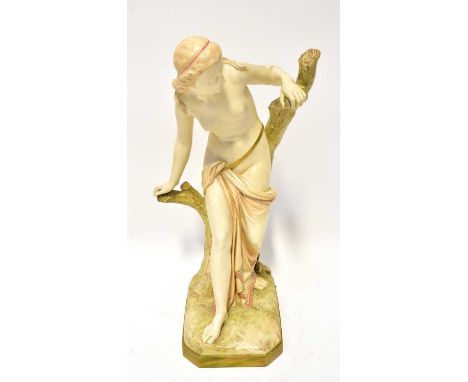 ROYAL WORCESTER; a porcelain figure 'The Bather Surprised', by Thomas Brock, modelled as a semi-nude woman leaning against a 