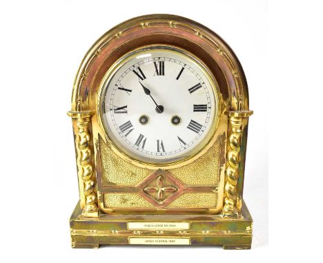 W. B. K. &amp; FILS, PARIS; an early 20th century gilded brass arched top mantel clock, the 5" white enamelled dial set with 