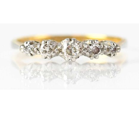 A 15ct yellow gold ring set with five graduated rose cut diamonds in a platinum claw setting, stamped '18ct Plat', size O, ap