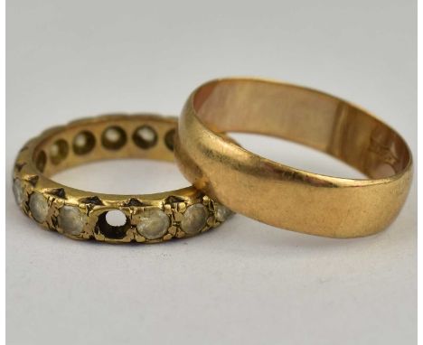 Two 9ct gold rings comprising a wedding band, size M, approx. 2.2g, and a white stone eternity ring, size L, approx. 2.7g (af