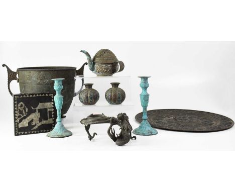 A Japanese cast metal stand in the form of a dragon chasing a pearl, together with a Tibetan pressed brass teapot, a pair of 