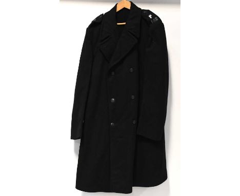 A vintage mid-century Metropolitan Police Officer's uniform for Police Constable 582, comprising an overcoat, trousers and a 
