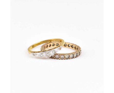 An 18ct gold ring with five small graduated diamonds set in platinum mount, together with a gold eternity ring set with white