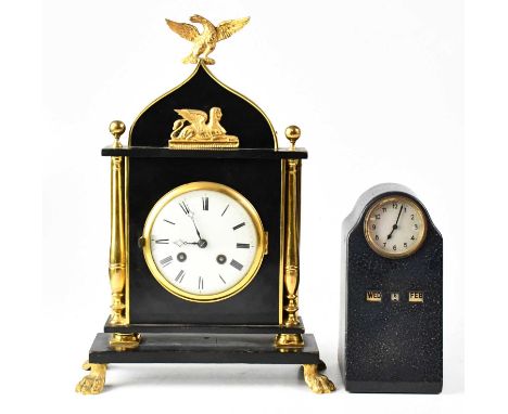 A late 19th/early 20th century gilt brass and ebonised architectural type mantel clock surmounted with an eagle above a sphin