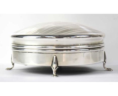 A George V hallmarked silver lidded circular jewellery box with engine turned decoration to the domed lid and initialled 'G',