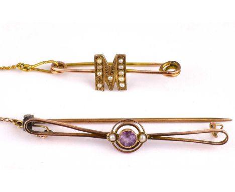 Two 19th century gold brooches, one initialled 'M' embellished with seed pearls, length 3.5cm, the other with small bezel set