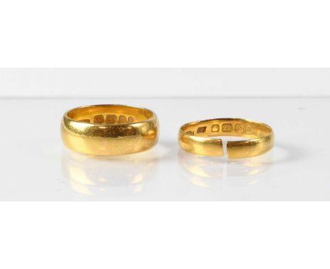Two 22ct gold wedding bands, sizes N and O approx. (cut), combined approx. 10.5g (2).Condition Report: -The shank of the size