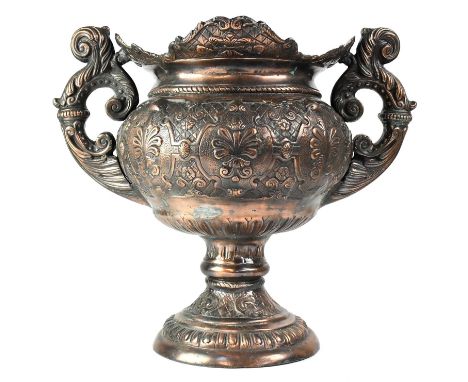 A 19th century bronzed metal twin-handled planter of Baroque style, with embossed strapwork and scroll decoration, raised on 