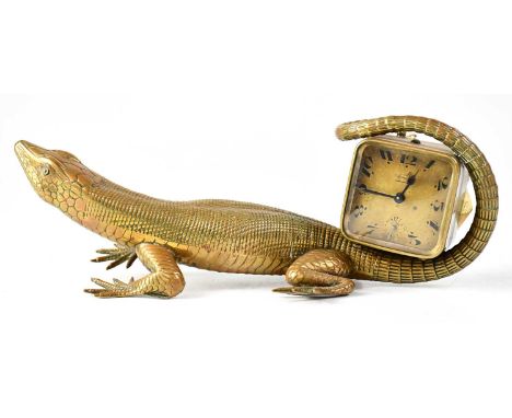 An unusual early 20th century French Art Deco brass table top clock in the form of a lizard, with associated Breveté S.G.D.G.